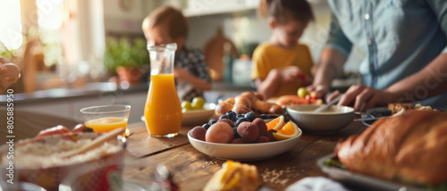A family moment of joy as hands prepare a colorful, delicious breakfast together. photo