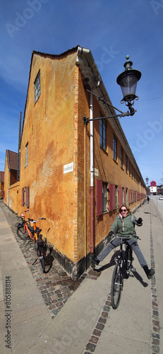 Photography woman driving crazy a bycicle in copenhagen
