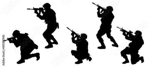 Silhouette of a male soldier carrying machine gun weapon.