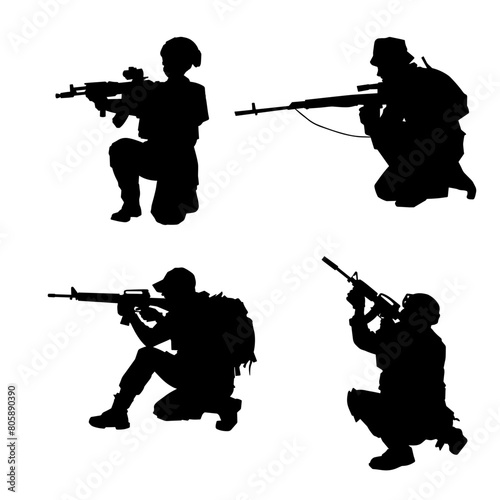 Silhouette of a shooter in squat position. Silhouette of a male soldier in action pose with his machine gun.