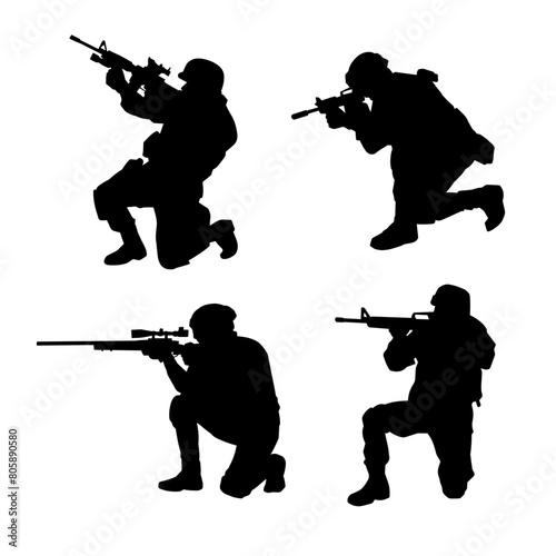 Silhouette of a shooter in squat position. Silhouette of a male soldier in action pose with his machine gun.