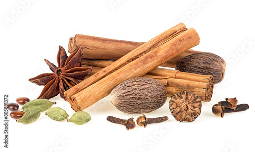 Traditional Christmas spices - cinnamon sticks, star anise, cloves, nutmeg and cardamom pods isolated on a white background. photo