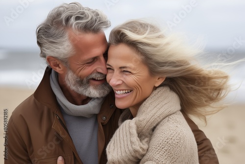 Happy Senior Couple Embracing on Beach