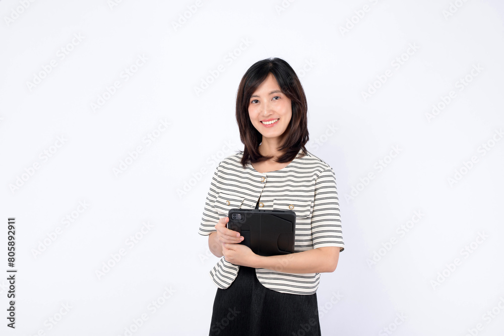 Asian woman is holding a tablet against a white background. Asian woman is holding a tablet against a white background.