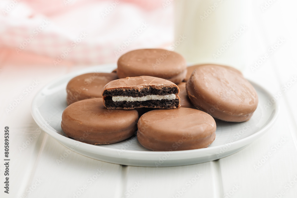 Plate of Chocolate Covered Cookies and Glass of Milk Plate of Chocolate Covered Cookies and Glass of Milk