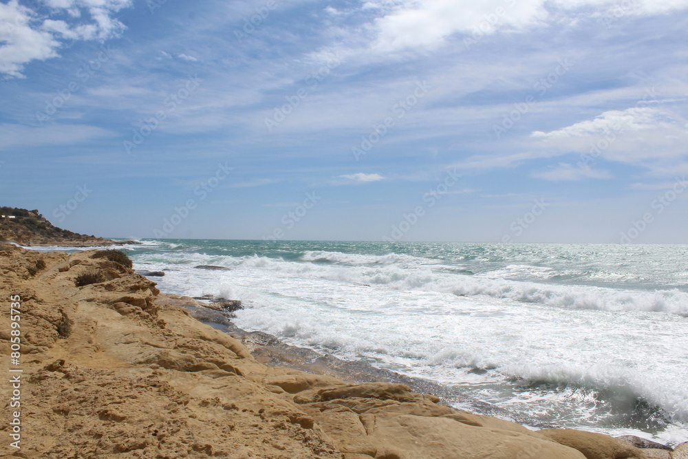 beautiful view of seashore,waves on the beach,   travel