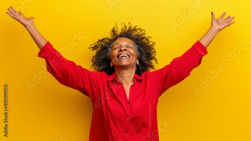 Joyful Woman with Arms Raised photo