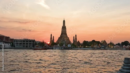 Wat Arun Ratchawararam Ratchawaramahawihan Temple or Wat Arun is a Buddhist temple in the Bangkok Yai near The River, Bangkok  Thailand. Landscape  Twilight Sunset Landmark Footage photo