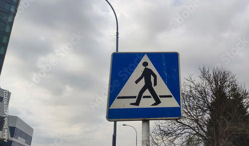 Pedestrian crossing, old road sign. Blue and white pedestrian crossing sign