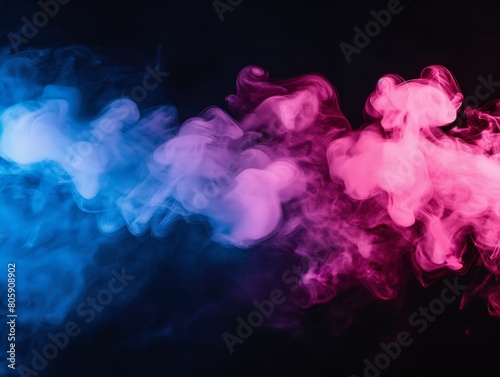 Vivid blue and pink smoke swirls on a black background, creating a dreamy and dynamic atmosphere. © cherezoff