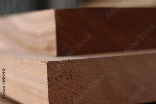 Photos close up of planks of hardwood in storage