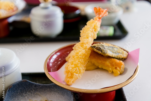 Shrimp tempura served on a red plate