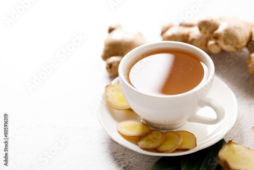 Ginger tea with ginger root and ginger slices.