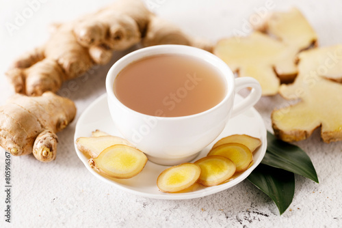 Ginger tea with ginger root and ginger slices.