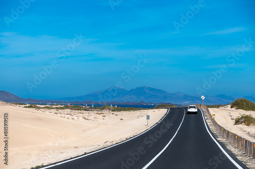 Driving car to north of Fuerteventura  sandy dunes  Corralejo  Canary islands  Spain