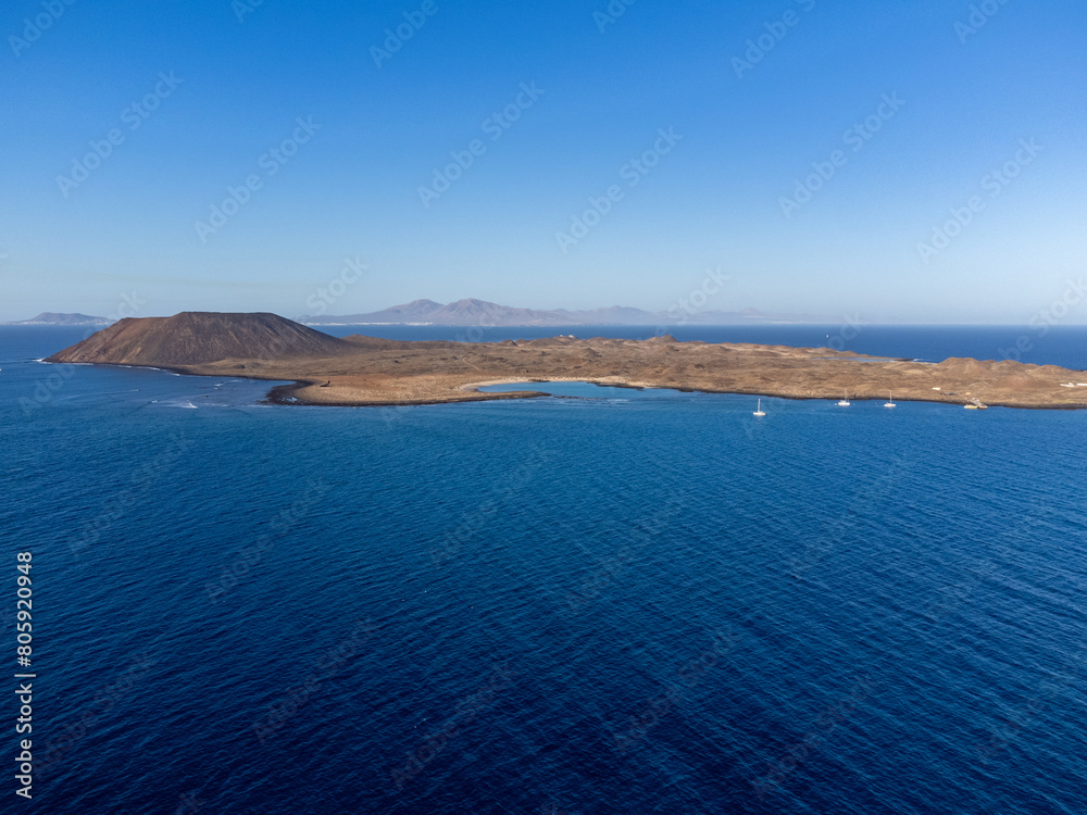 Aerial view Corralejo dunes, white sandy beach, blue water, Lobos and Lanzarote islands, Fuerteventura, Canary islands, Spain