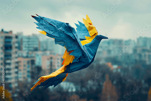 origami dove or bird in the ukranian national colours or flag flying over a destroyed and abandoned city, concept for peace, war and armed conflict