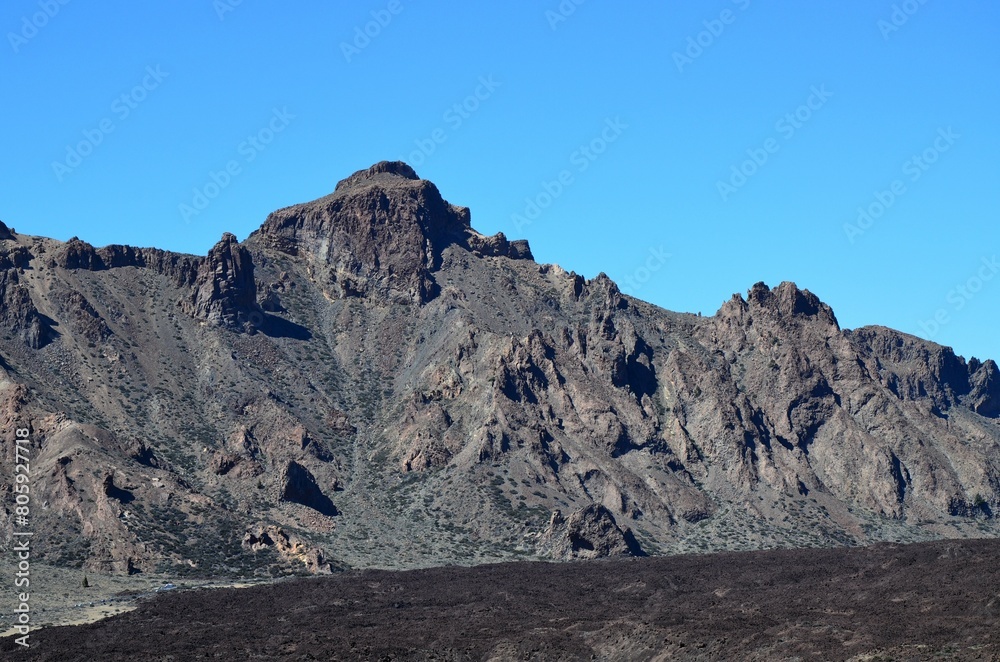 Scenic view of volcanic rock formations in desert during sunny day, Teide National Park, Tenerife