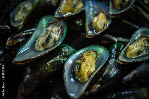 Fresh shelled mussels for sale at the Ban Na Kluea seafood market, Thailand.