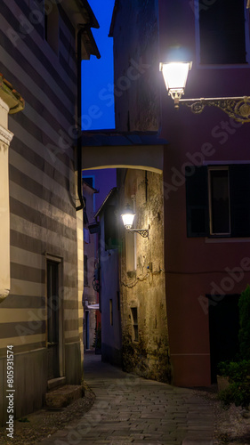 The night streets of the medieval city Albenga, Savona, Italy.