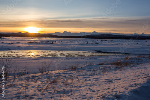Beautiful view of Tanana River landscape in frozen weather in Alaskan winter in sunset photo