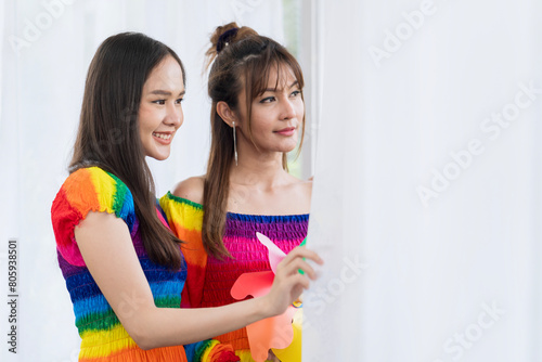 LGBT concept. woman in a rainbow dress. woman in coat multicolored.