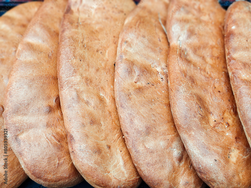 Fresh-baked caucasian bread for sale at the local city market Fresh-baked caucasian bread for sale at the local city market