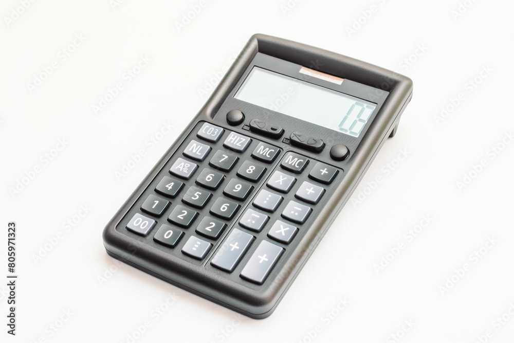 A classic pocket calculator with a black case and silver buttons, displaying a random number, resting on a white background. A classic pocket calculator with a black case and silver buttons, displaying a random number, resting on a white background.