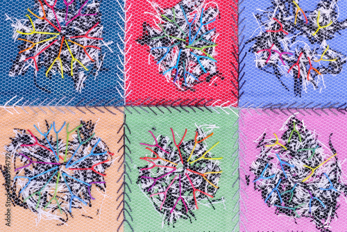 Abstract multicolored textile background texture with stitches.