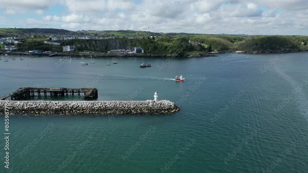 Brixham, Torbay, South Devon, England: DRONE VIEWS: A fishing trawler leaves the harbour heading for the open seas. Brixham is a major UK fishing port and holiday resort (Clip 2). Brixham, Torbay, South Devon, England: DRONE VIEWS: A fishing trawler leaves the harbour heading for the open seas. Brixham is a major UK fishing port and holiday resort (Clip 2).
