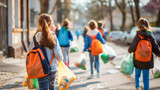 copy space, stockphoto, schoolchildren collecting trash in the street during a zero waste event. School children collecting waste from the streets in plastic bags, during a clean up. Environmental the