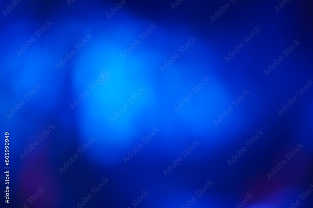 Abstract image with soft undefined shapes of blue color and blurry lights like those of a music concert stage. Dark background. Abstract image with soft undefined shapes of blue color and blurry lights like those of a music concert stage. Dark background.