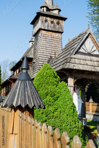 DZIANISZ, POLAND - MAY 04, 2024: Historic wooden church and its surroundings in Dzianisz, Poland.