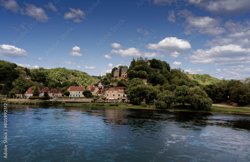 Village of Limeuil in the Dordogne, blue sky and river
