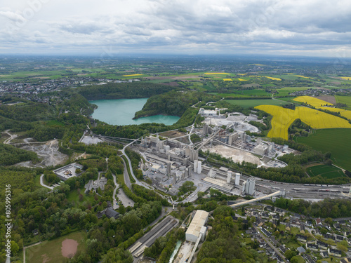 Large mining and quarry installation at the mines at Rutzkausen, Germany. Lime stone, chalk mining. Raw materials extraction from the earth. Aerial drone view.