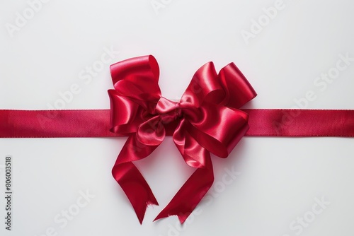 red ribbon with red bow on white background