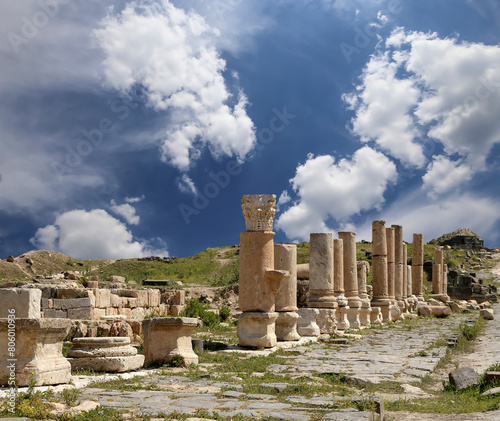 Roman ruins at Umm Qais (Umm Qays)--is a town in northern Jordan near the site of the ancient town of Gadara, Jordan. Against the background of a beautiful sky with clouds photo