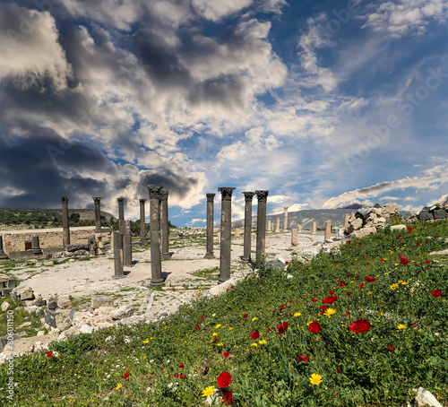 Roman ruins at Umm Qais (Umm Qays)--is a town in northern Jordan near the site of the ancient town of Gadara, Jordan. Against the background of a beautiful sky with clouds photo