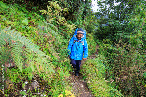 Sherpa mountain guide between the camps Thudam and Kharka in a remote area in the Makalu region, Himalaya, Nepal on the Great Himalaya Trail (GHT) photo