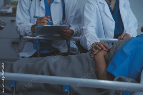 Cropped shot of a female nurse hold her senior patient's hand. Giving Support. Doctor helping old patient with Alzheimer's disease. Female carer holding hands of senior man © Sirikarn Rinruesee