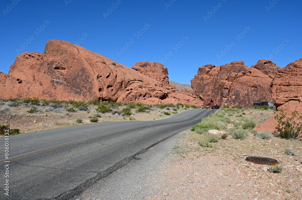 Road running through The Valley of Fire state park on a scorching April day in 2024. Road running through The Valley of Fire state park on a scorching April day in 2024.