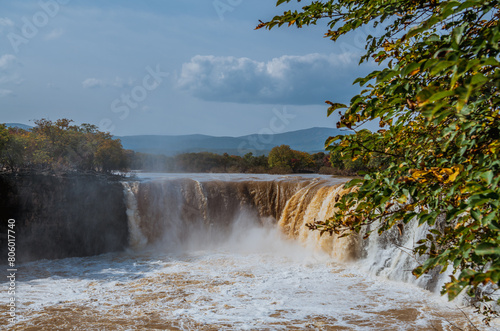 Waterfall at Jingbo Lake Scenic Area in Mudanjiang, Heilongjiang, China in autumn photo