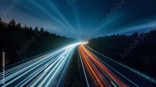 Nighttime long exposure of a road. A vibrant long exposure shot capturing the dynamic lights of cars traversing a road at night  reflecting the urban pulse