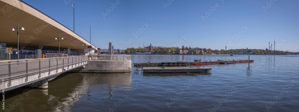 The new sluice gate at the old town Gamla Stan, the yellow steel bridge Guldbron, a sunny spring day in Stockholm