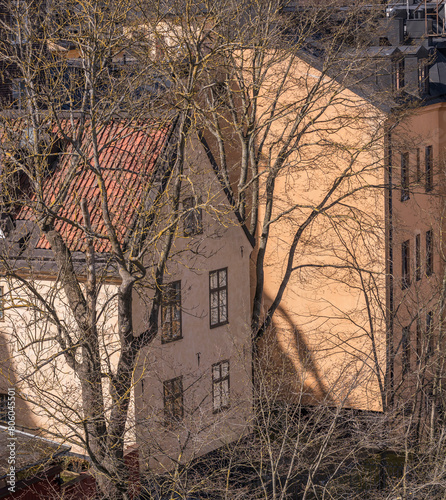 Old yellow 1700s houses at sluice blocks in the district Södermalm, a sunny spring day in Stockholm