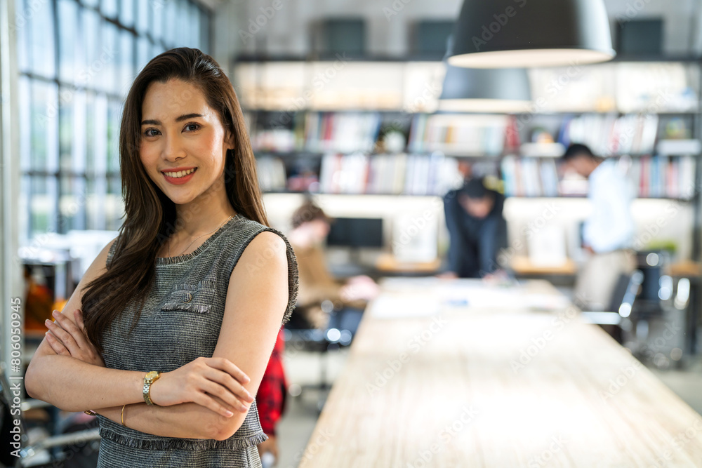 Portrait of smiling successful happy relax profile attractive confident asian creative business woman, fashionable, model, creative female look at camara enjoying standing at office