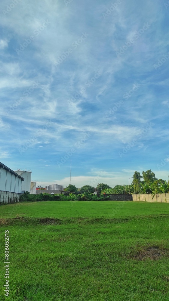 An empty space land planted by grass can be buy or rent to build warehouse or factory in industrial area