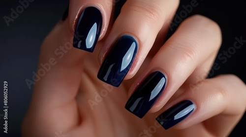 woman hand with black nail polish on her fingernails