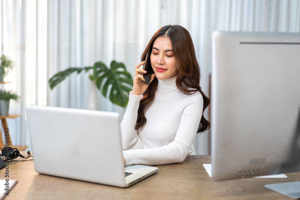 Young businesswoman work relaxing using technology laptop computer on table at office.Young creative woman working and typing on keyboard, technology, online, email, job, project on workplace Young businesswoman work relaxing using technology laptop computer on table at office.Young creative woman working and typing on keyboard, technology, online, email, job, project on workplace