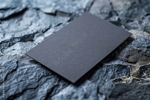 black close up of a dark grey business card